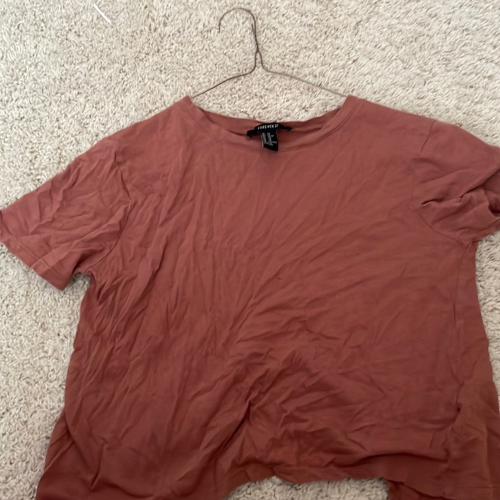 A Shirt with a beautiful color and has a open back